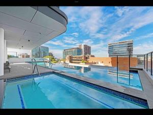 a swimming pool on the roof of a building at Prime Located Luxe 2 BR Sky Home/Sensational Views in Brisbane
