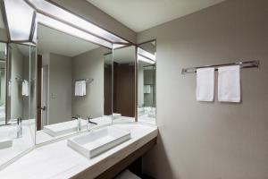 a bathroom with two sinks and a large mirror at Karuizawa Marriott Hotel in Karuizawa