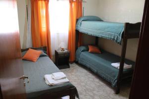 a bedroom with two bunk beds and a window at Departamento muy amplio y cómodo. Impecable! PB in San Rafael