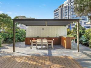 a pavilion with a table and chairs on a patio at Luxe 2bed/2Bath/Park in Newstead in Brisbane