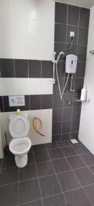a bathroom with a toilet and a shower at My Home N2 @ Golden Hills Night Market in Cameron Highlands