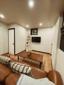 a living room with a couch and a coffee table at 1-bedroom apartment in Uptown Waterloo in Waterloo