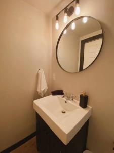 a bathroom with a sink and a mirror at 1-bedroom apartment in Uptown Waterloo in Waterloo