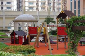 a playground with a slide and a gazebo at Luxe in Venice in Manila
