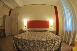 Postel nebo postele na pokoji v ubytování Hotel Stipino
