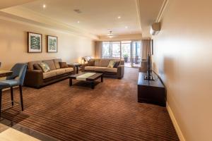 a living room with a couch and a table at Apartment 2, 9 River Lane Mannum in Mannum