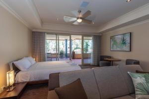 a bedroom with a bed and a couch at Apartment 2, 9 River Lane Mannum in Mannum
