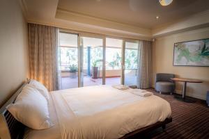 a hotel room with a bed and a large window at Apartment 4, 9 River Lane Mannum in Mannum