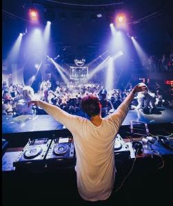 a man standing in front of a crowd at a concert at Cana Rock Star luxury condo, Casino, golf, beach in Hard Rock área in Punta Cana