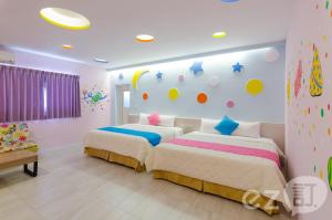 Ένα ή περισσότερα κρεβάτια σε δωμάτιο στο Mu Yu B&B