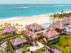 an aerial view of a resort with a beach at Cana Rock Star luxury condo, Casino, golf, beach in Hard Rock área in Punta Cana