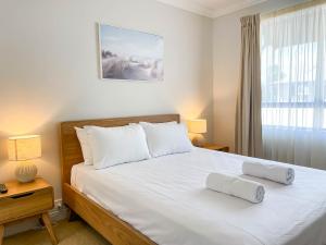 Postel nebo postele na pokoji v ubytování Trinity Links Resort