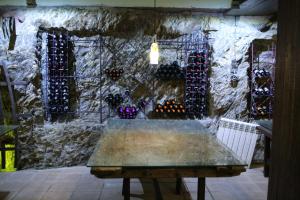 a room with a bunch of wine bottles on a wall at Hotel Rural La Enoteca del Marques in Fermoselle