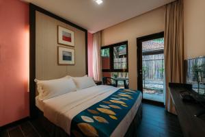 a hotel room with a bed and a window at Kranji Sanctuary Resort in Singapore