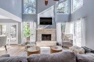a living room with a couch and a fireplace at 2b1b Hidden Oasis in the Hills- Close to Downtown in Austin