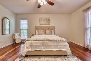 a bedroom with a bed and a ceiling fan at Lake Murray Retreat in Lexington