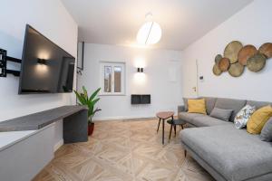 טלויזיה ו/או מרכז בידור ב-Madalì Suite & Apartments Brescia