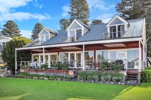 a house with a large porch with a lawn at Johanssons Perch 2 in Port Fairy