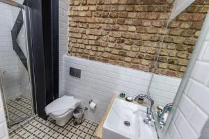 a bathroom with a toilet and a sink at Calanthe Residence in Istanbul