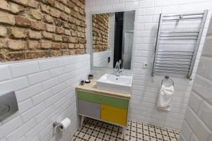 a bathroom with a sink and a mirror at Calanthe Residence in Istanbul