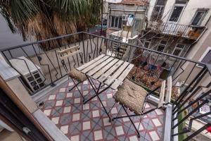 an overhead view of a balcony with a bench and chairs at Calanthe Residence in Istanbul