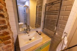 a bathroom with a sink and a mirror at Calanthe Residence in Istanbul