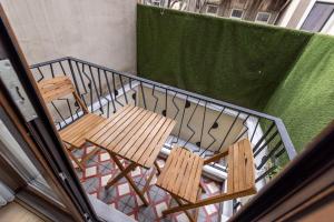 two chairs sitting on a balcony with a railing at Calanthe Residence in Istanbul