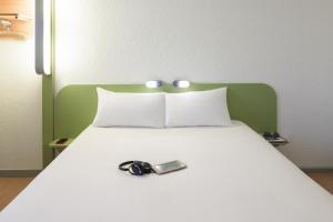Postel nebo postele na pokoji v ubytování Ibis budget Dunkerque Grande Synthe