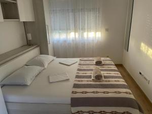 Postel nebo postele na pokoji v ubytování Kozino Apartments