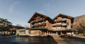 a large building on the side of a street at Hotel Post Bezau in Bezau