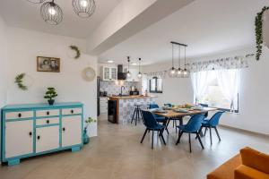 a kitchen and dining room with a table and chairs at House with pool Poli Stare nuoni in Žminj