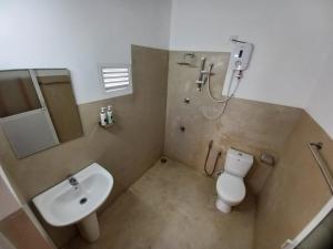 a bathroom with a sink and a toilet and a shower at Couple rooms in Negombo in Negombo +51 photos