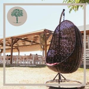 a basket sitting on a stand in a field at Florida Resort in Bačka Palanka