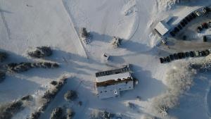 an aerial view of a bus in the snow at Terre de Sapins in Orbey +41 photos
