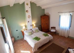 Postel nebo postele na pokoji v ubytování Villa San Regolino whit private pool + 37 fotografií