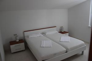 Voodi või voodid majutusasutuse Vila Vito toas