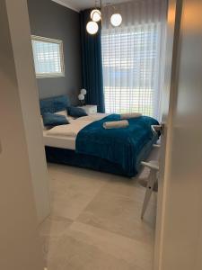 Posteľ alebo postele v izbe v ubytovaní Lazy Deer - Apartamenty