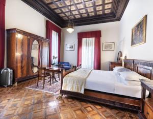 Postel nebo postele na pokoji v ubytování Hotel Palace Bologna Centro