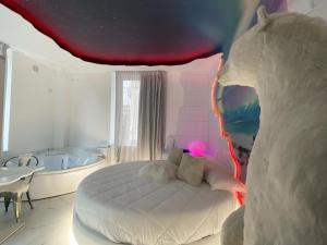 A bed or beds in a room at Suite Dreams Montecatini