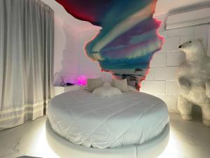 A bed or beds in a room at Suite Dreams Montecatini