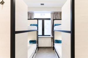 Łóżko lub łóżka w pokoju w obiekcie LOGUNE ROOMS