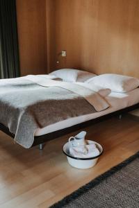 A bed or beds in a room at Hotel Post Bezau