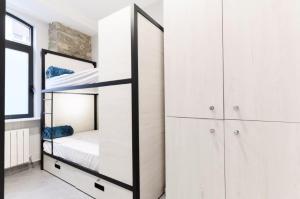 Łóżko lub łóżka w pokoju w obiekcie LOGUNE ROOMS