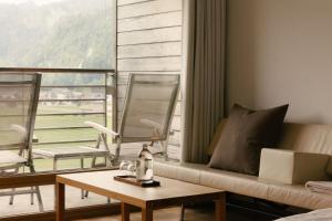 A seating area at Hotel Post Bezau