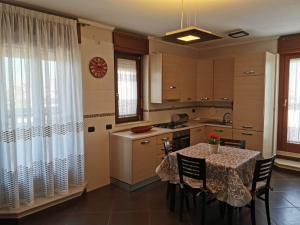A kitchen or kitchenette at NSM Casa di Fulmine attico con box privato