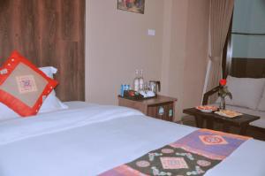 Postel nebo postele na pokoji v ubytování Sapa Hills Hotel