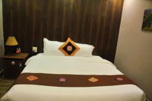 Postel nebo postele na pokoji v ubytování Sapa Hills Hotel