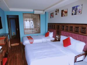 Postel nebo postele na pokoji v ubytování Sapa Hills Hotel