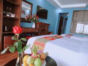Postel nebo postele na pokoji v ubytování Sapa Hills Hotel