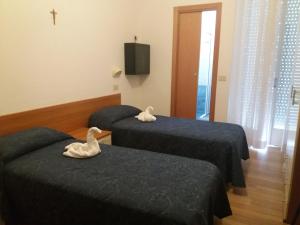 Postel nebo postele na pokoji v ubytování Hotel Atlas